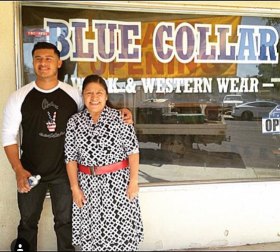 Angle poses proudly with mom Yolanda Robles at site of his new Hanford Blue Collar store.